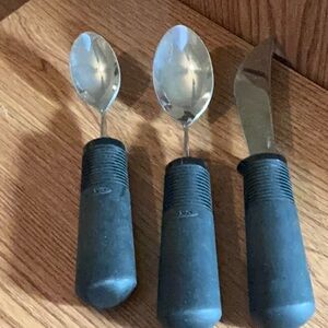 Three OXO utensils. One small and one big spoon and a knife